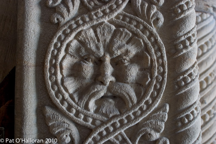 Green man at entrance door